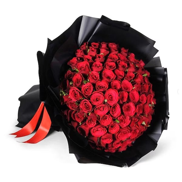 Bouquet of red roses wrapped in black paper wrap