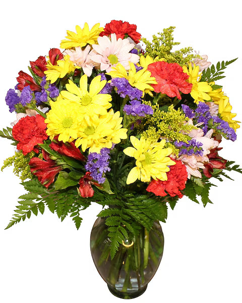 Bouquet of colorful flowers in a clear vase
