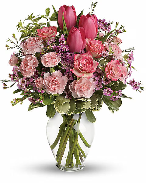 Bouquet of pink flowers in a clear vase