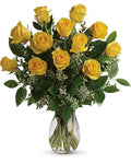 Bouquet of yellow roses in a clear vase 