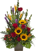 Colorful flower arrangement with red roses, yellow sunflowers, and greery 